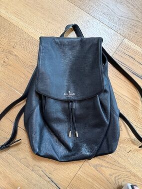 kate spade black pebbled leather flap backpack
